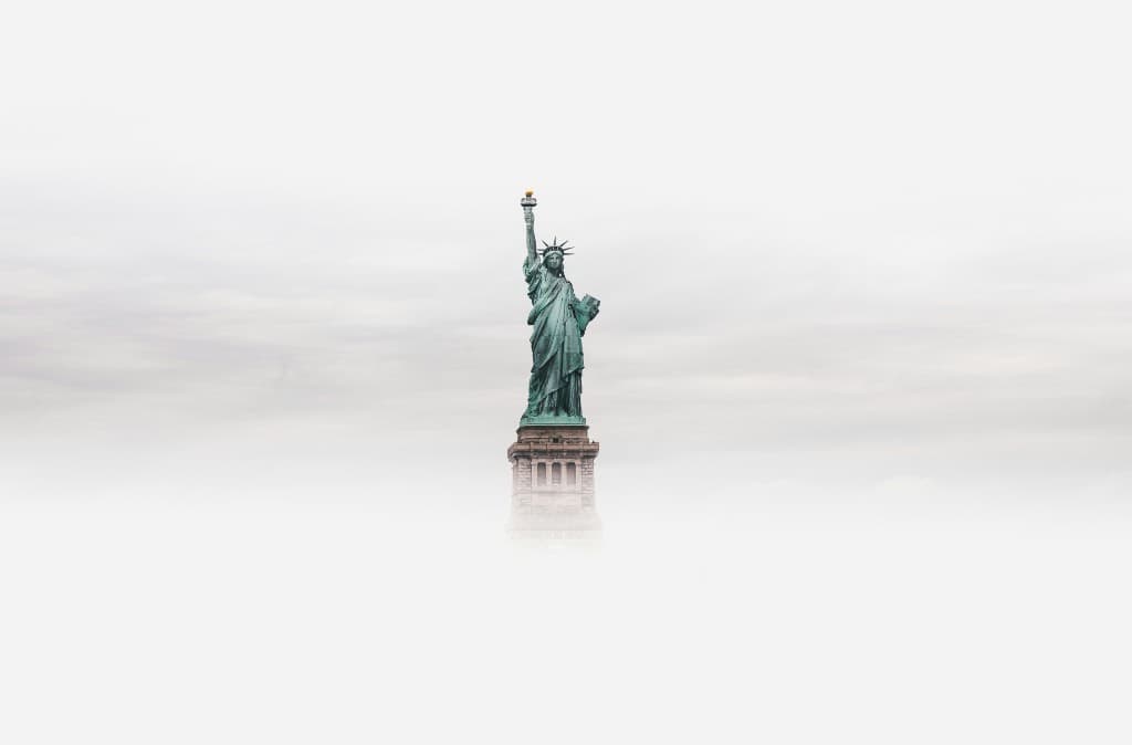 Statue of Liberty emerging from soft fog